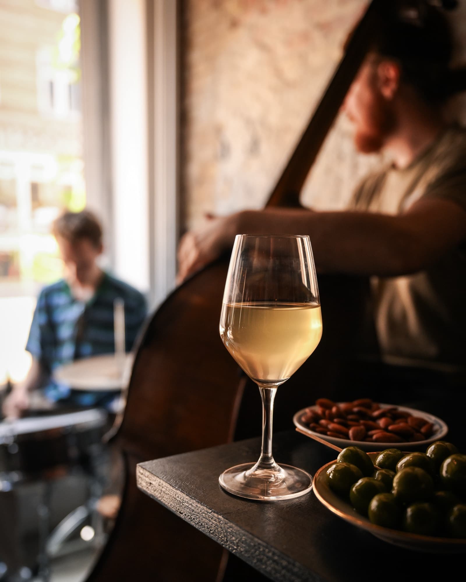 Live music in the bar on a full evening lit by candles